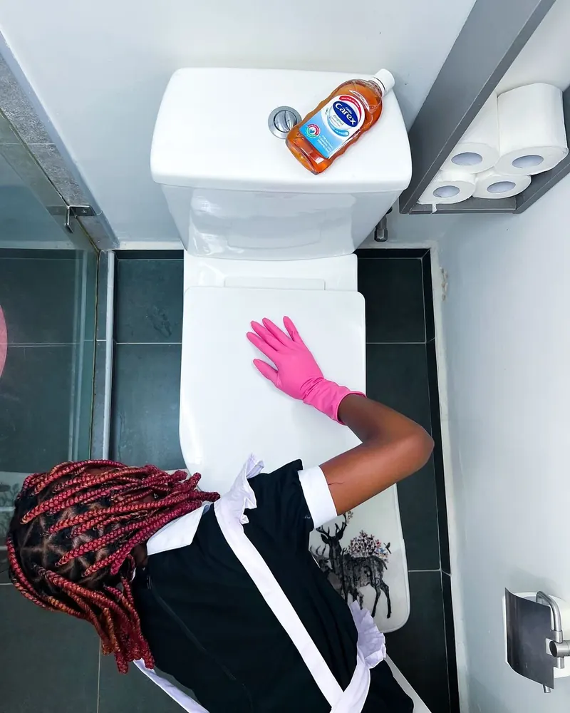 A thorough deep clean in progress, pink gloves at work